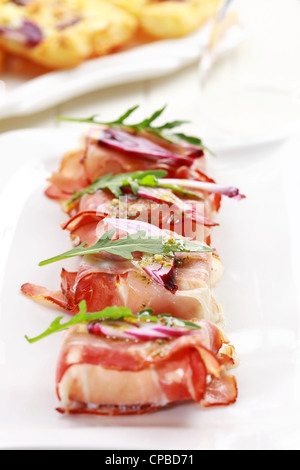 Fresh prosciutto rolls closeup Stock Photo - Alamy