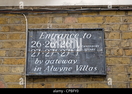 notice giving location of entrances to flats on canonbury square, london, england, including that once occupied by george orwell Stock Photo