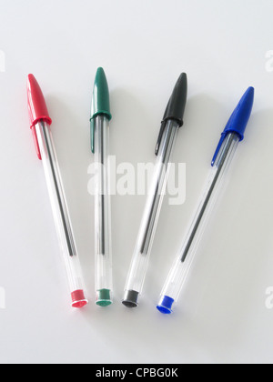 Selection of Red, Green, Black & Blue Crystal Bic Pens on a White Background Stock Photo