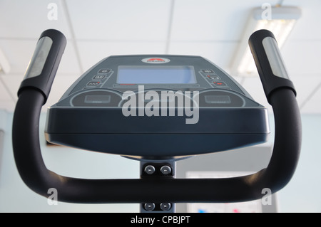 Gym equipment close up showing touch pad programming screen and heart rate handle grips Stock Photo