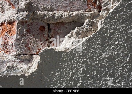 damaged plaster on building corner Stock Photo