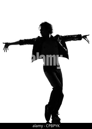 full length silhouette of a young man dancer dancing funky hip hop r&b on  isolated  studio white background Stock Photo