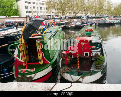 Rows of houseboats and narrow boats on the Grand Union Canal at a Festival in Little Venice, Paddington, West London, Stock Photo