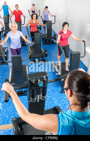 Fitness instructor leading treadmill running class at health club Stock Photo