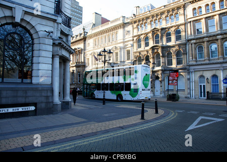 Hybrid powered bus in Birmingham city centre. Green public transport to help reduce greenhouse gases. Stock Photo