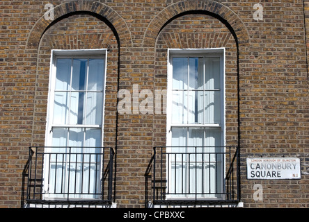 street name sign for canonbury square, islington, london, england, alongside  sash windows of 19th century  house Stock Photo