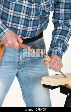 A carpenter using a chisel. Stock Photo