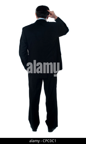 Rear view of corporate person thinking. Isolated over white Stock Photo