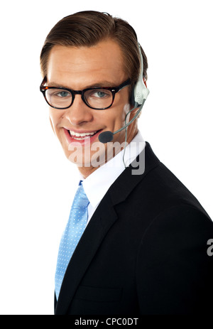 Smiling telemarketing male executive, closeup shot. Smiling Stock Photo