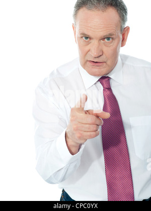 Portrait of an angry middle aged businessman in suit pointing at you isolated over white background Stock Photo