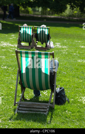 Stripped deck chairs at St James park, London. UK Stock Photo - Alamy