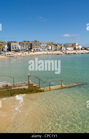 St. Ives harbour beach shallow sea water on a sunny day in Cornwall UK. Stock Photo