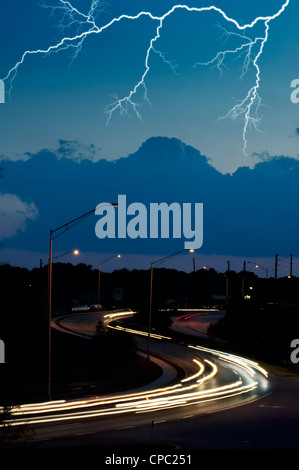 lightning bolt in night sky over street lights Stock Photo - Alamy