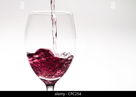 Filling up a wineglass Stock Photo