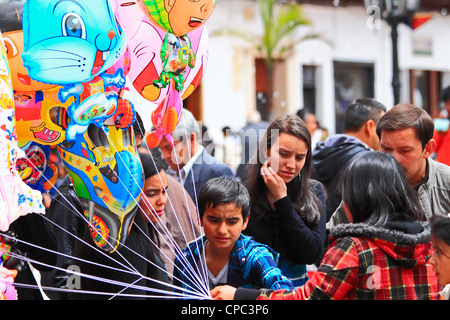 Working chld. A girl selling ballons in the street. Tunja, Boyacá, Andes, Colombia, South America Stock Photo