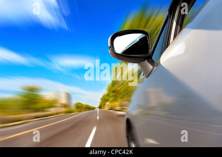 car on the road with motion blur background Stock Photo