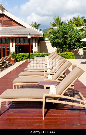 Lounge chairs at resort garden Stock Photo