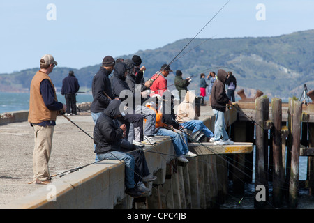 Fishermen on pier Stock Photo