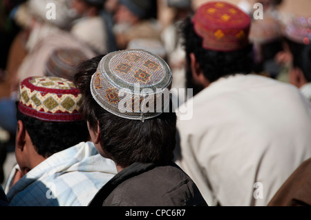 Men wearing traditional hats in Helmand, Afghansitan Stock Photo