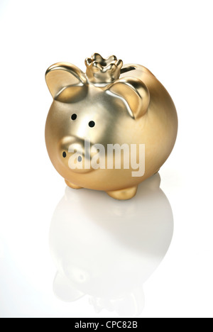 Golden piggy bank with a crown isolated on white background. Stock Photo