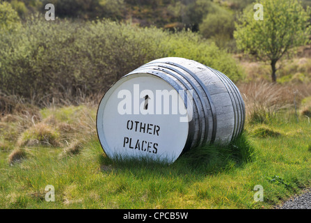 Whisky barrel signpost on the roadside 'Bunnahabhain Distillery 1/2 ...