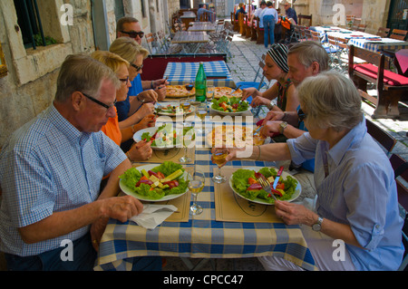 Group of Finnish holiday-makers having pizza and salad in Mea Culpa restaurant Dubrovnik city Dalmatia Croatia Europe Stock Photo