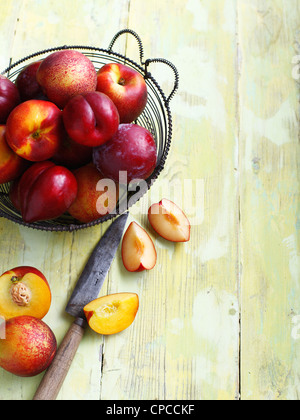 Sliced fruit on wooden board Stock Photo