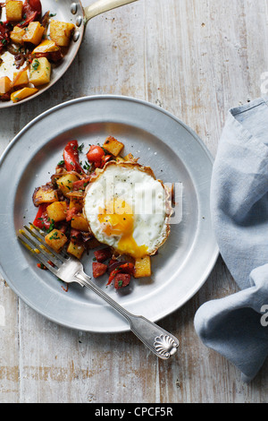 Plate of fried egg with potatoes Stock Photo