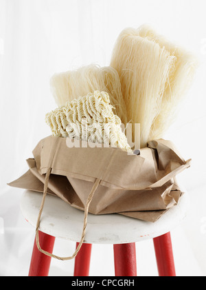 Dried noodles in paper bag Stock Photo