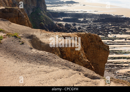 Crumbling carboniferous sandstone eroding on the cliffs along the Cornish north coast in Bude Cornwall England UK Britain Stock Photo