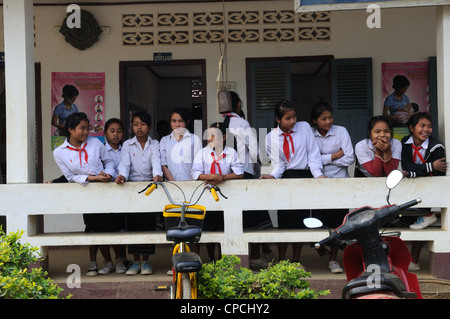 Lao school children during a presentation of books and stationary by tourists Ziemg Khuang Province Northern Laos Stock Photo