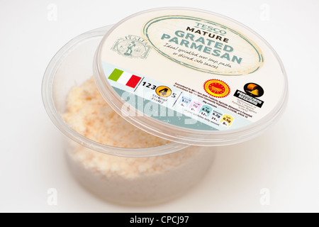 Grated cheese in plastic container on table Stock Photo - Alamy