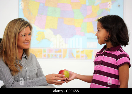 Teacher and Student In A Classroom At School Stock Photo