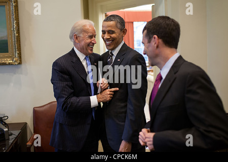 President Barack Obama talks jokes with Vice President Joe Biden and Senior Advisor David Plouffe in the Outer Oval Office April 26, 2012 in Washington, DC. Stock Photo