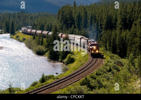 A Canadian Pacific train travelling through Morants Curve, near Lake Louise, Alberta, Canada Stock Photo