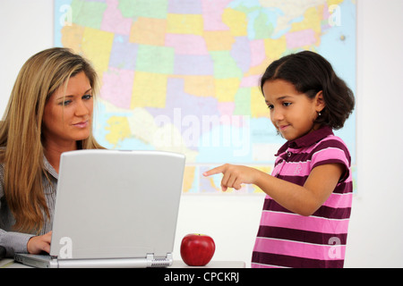 Teacher and Student In A Classroom At School Stock Photo