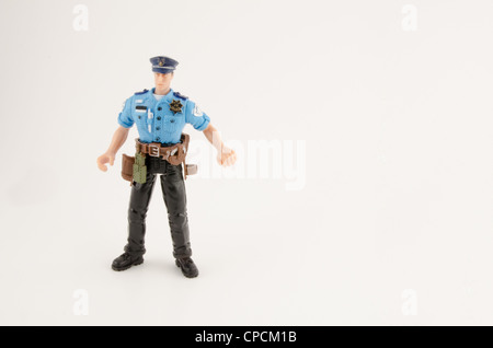 Plastic figure of Police Officer, isolated on white Stock Photo