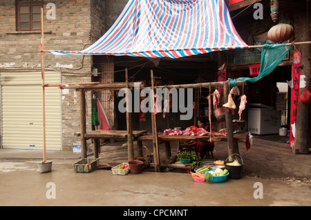 A typical butcher stall in a Dong people village, Southern China Stock Photo