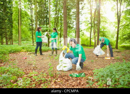 Gardeners picking up trash in park Stock Photo