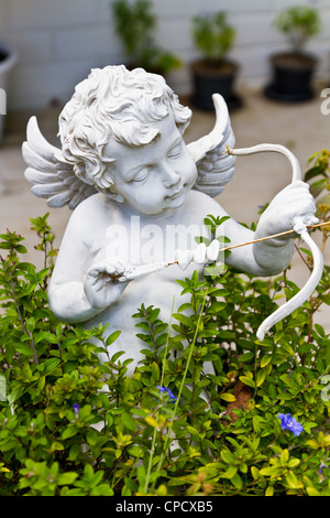 Statue of cupid in the garden Stock Photo