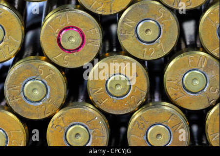 Primers of M2 Browning .50 caliber machine gun cartridges in ammunition belt made by FN Herstal weapon factory in Belgium Stock Photo