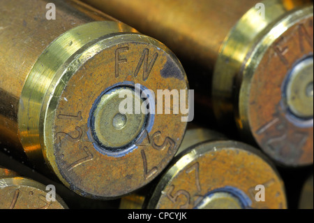 Primers of M2 Browning .50 caliber machine gun cartridges in ammunition belt made by FN Herstal weapon factory in Belgium Stock Photo