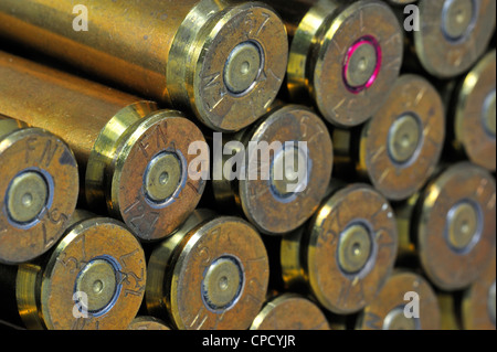 Primers of M2 Browning .50 caliber machine gun cartridges in ammunition belt made by FN Herstal weapon factory in Belgium Stock Photo