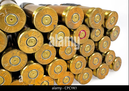 Primers of M2 Browning .50 caliber machine gun cartridges in ammunition belt made by FN Herstal weapon factory in Belgium Stock Photo