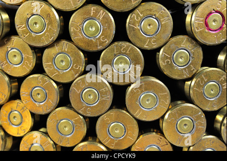 Primers of M2 Browning .50 caliber machine gun cartridges in ammunition belt made by FN Herstal weapon factory in Belgium Stock Photo