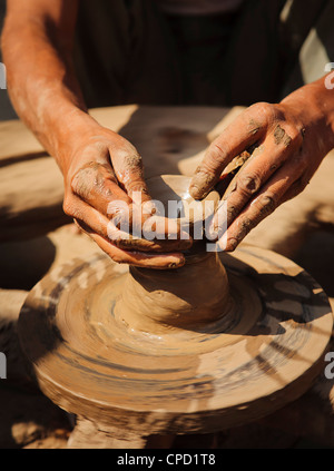 A potter crafts earthenware pottery on clay in Pune, India Stock Photo ...