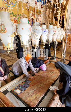 Church of the Holy Sepulchre with crosses and lanterns, the Stone of the Unction, Christian Quarter, Old City, Jerusalem, Israel Stock Photo