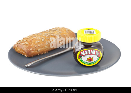 Marmite jar with bread on a plate Stock Photo