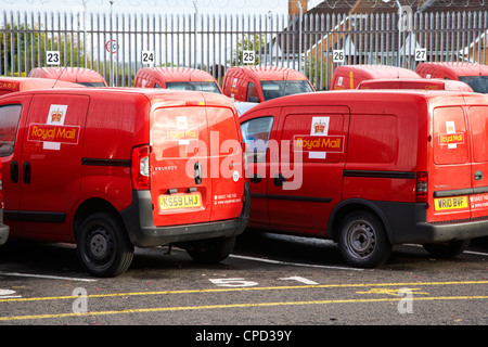 row of royal mail vans in a mail centre in the uk Stock Photo