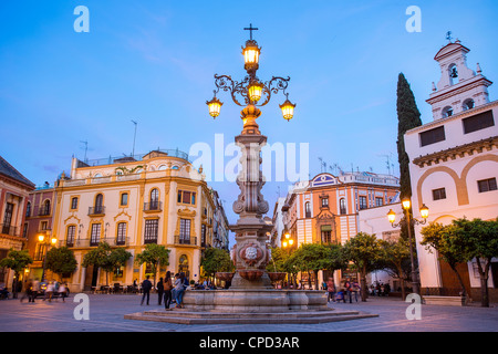 Europe, Spain Andalusia, Sevilla, Plaza Virgen de los Reyes at Dusk Stock Photo